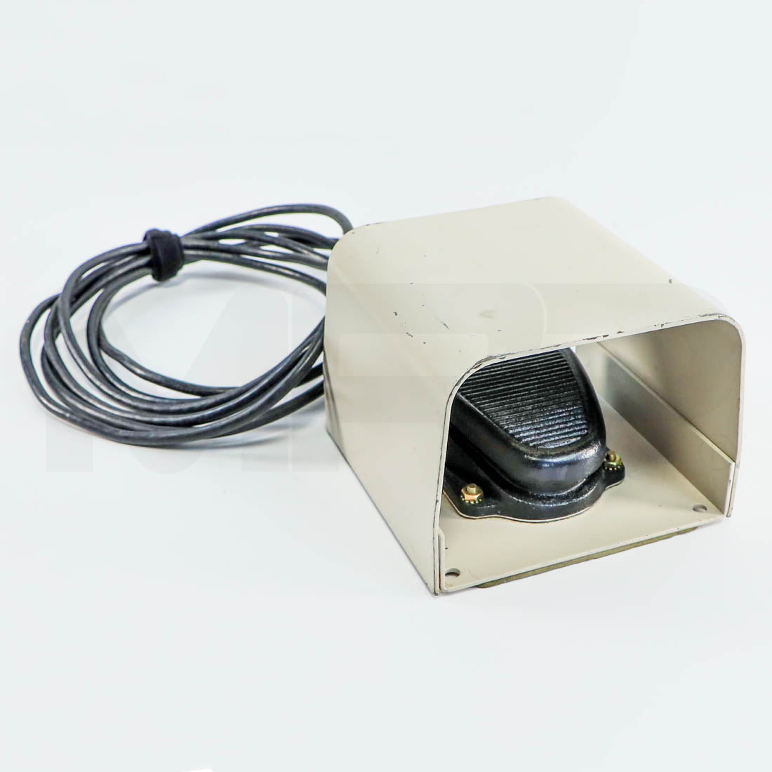 ConBio MedLite IV Q-Switched foot pedal with beige metal guard and black coiled cable