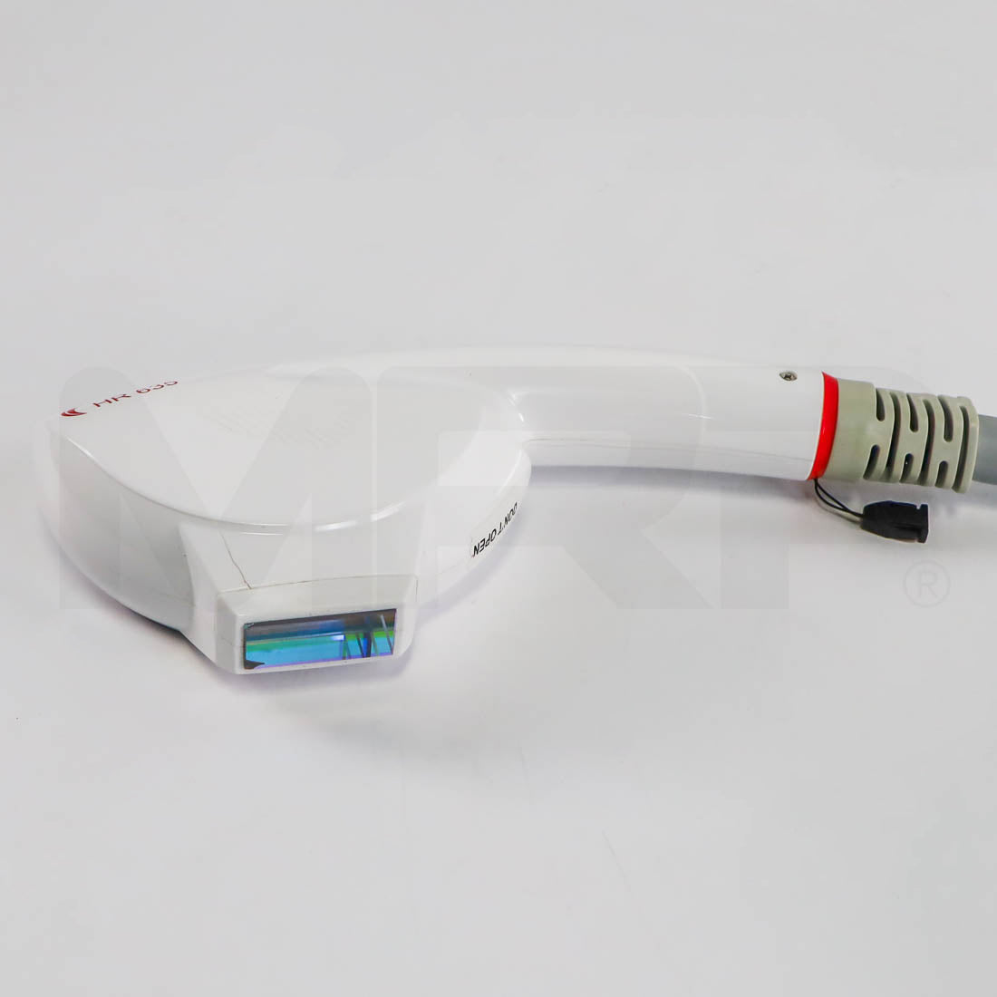 SharpLight HR 635 IPL handpiece side view showing cracked housing near treatment window