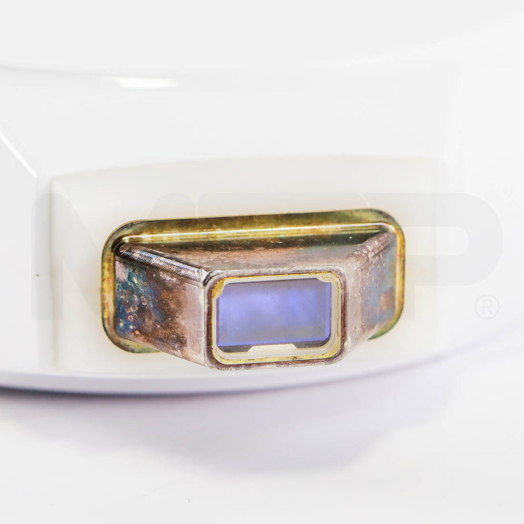 SharpLight Dual VP handpiece close-up of tarnished metal light guide and treatment window